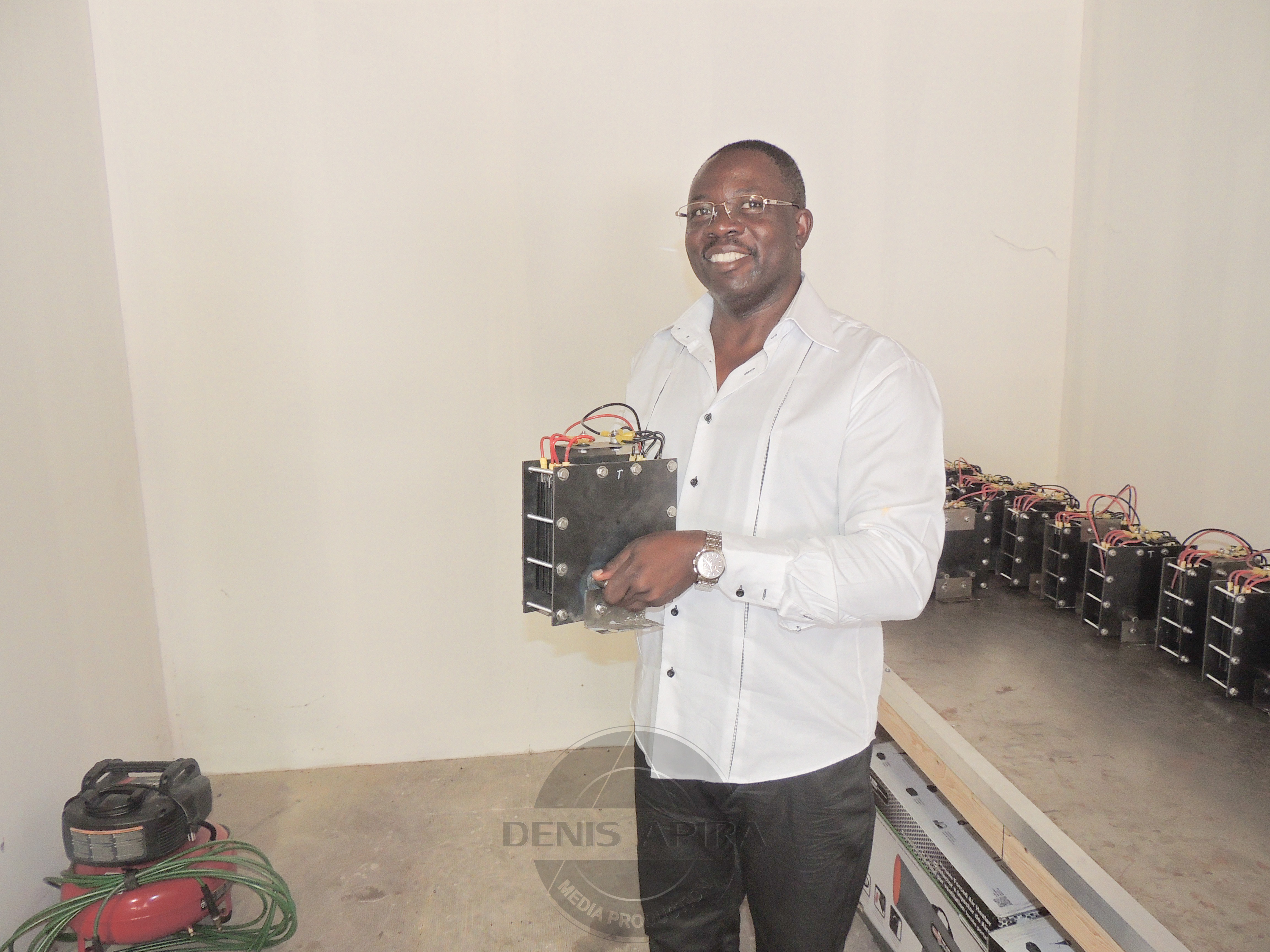 The Dallas-based Mr. Marvin Apira, the newly appointed representative of the company in East Africa holding the Hydro-Gen25 generator.